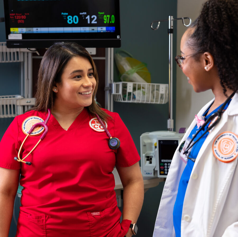 Two undergraduate female students from The University of Texas at Tyler's School of Nursing have a discussion