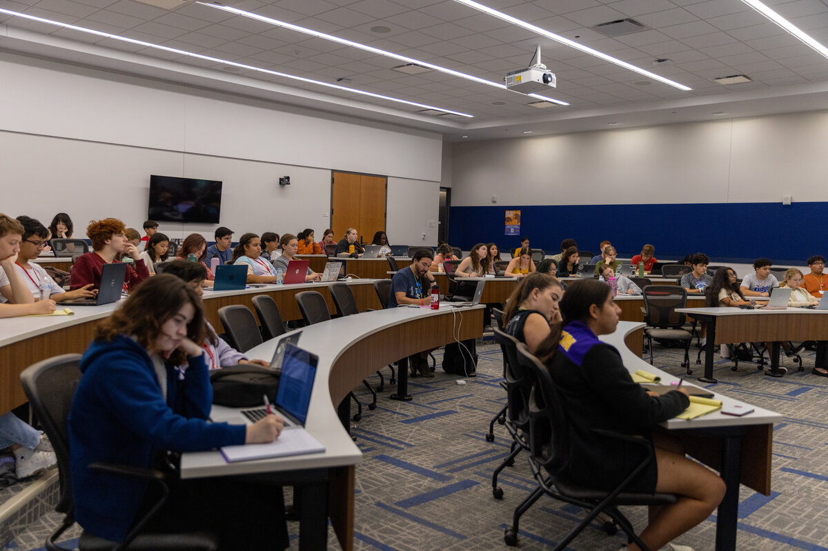 Students sitting in a lecture in a College of Arts and Sciences room