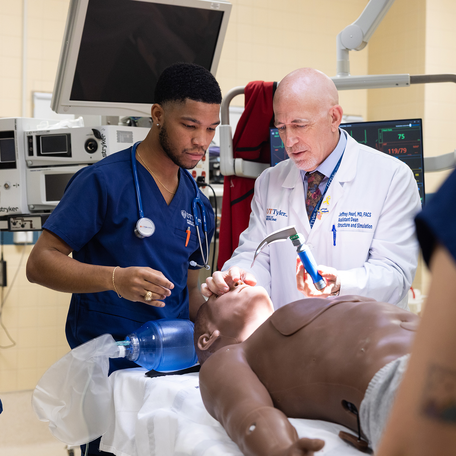 Student putting on white coat