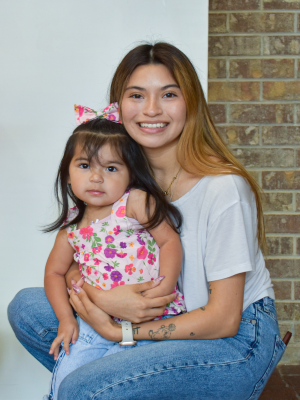 Bliss and her daughter graduated alongside 16 other mothers with their toddlers from the Nurse Family Partnership program, which connects trained nurses with first-time mothers to provide convenient, in-home visits twice a month at no charge from pregnancy until the child’s second birthday.
