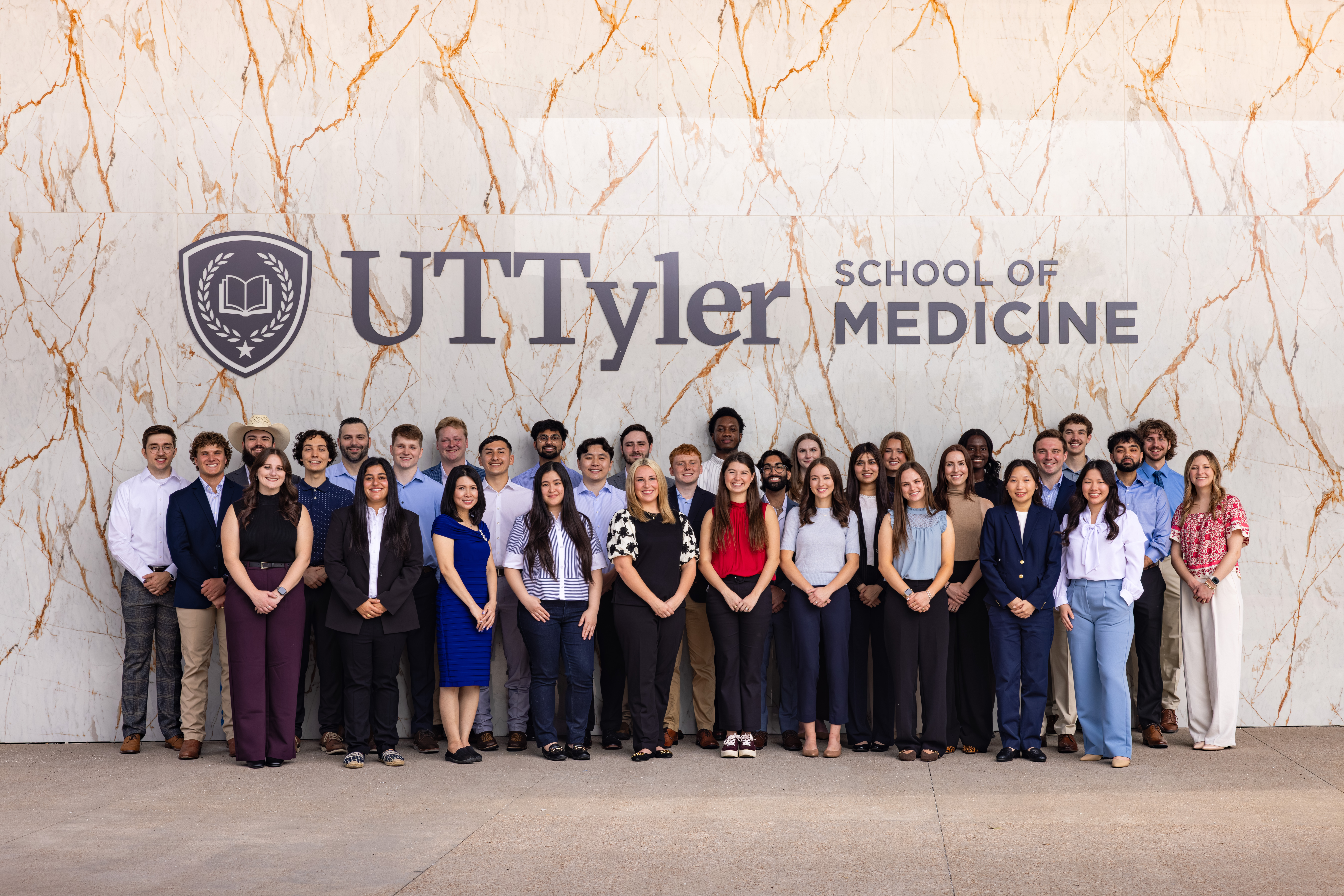 Group of medical students in their white coats.