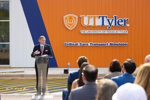UT System Chancellor John M. Zerwas speaks at the ribbon cutting of the Helicopter Critical Care Transport Simulation Center, designed to train both nurses and paramedics in critical care transportation.