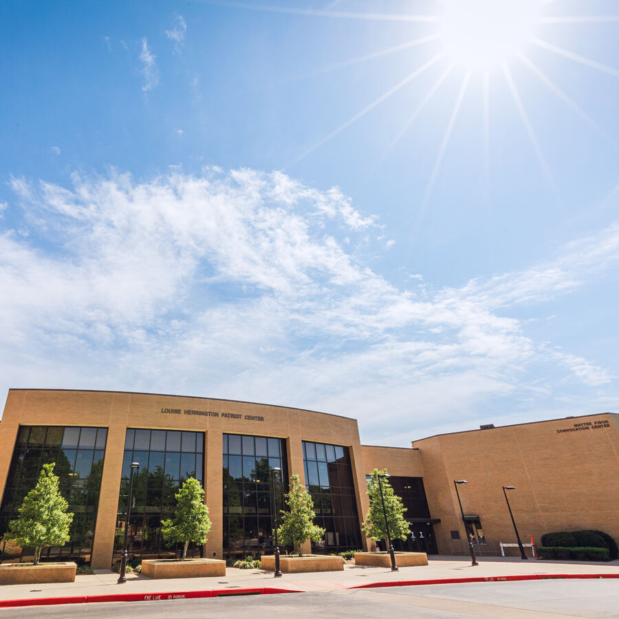 Outside the Herrington Patriot Center at The University of Texas at Tyler on a clear day