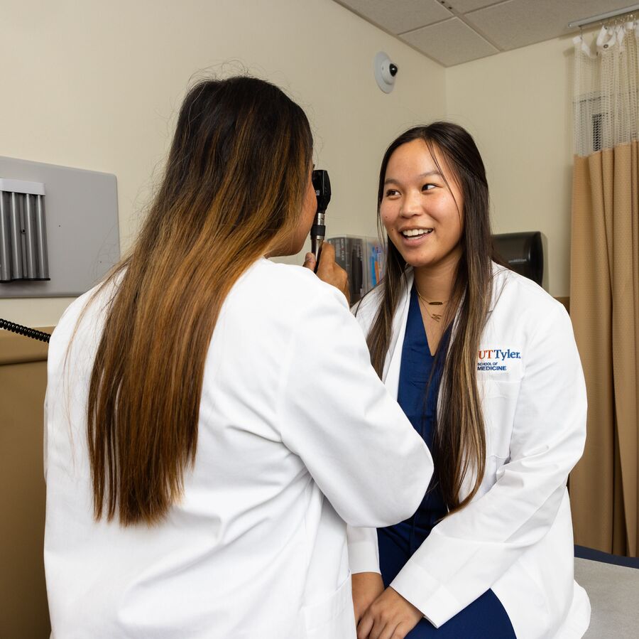 School of Medicine students practice taking vital signs on each other