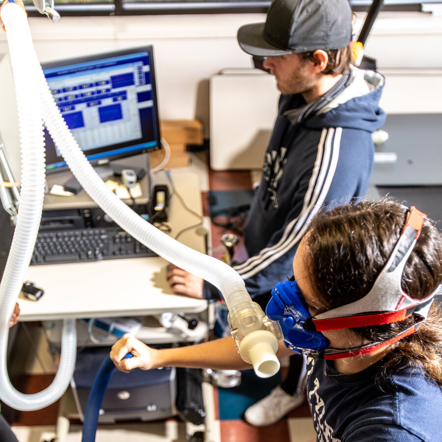 A UT Tyler School of Health Professions undergraduate student practices monitoring a patient in a simulated space