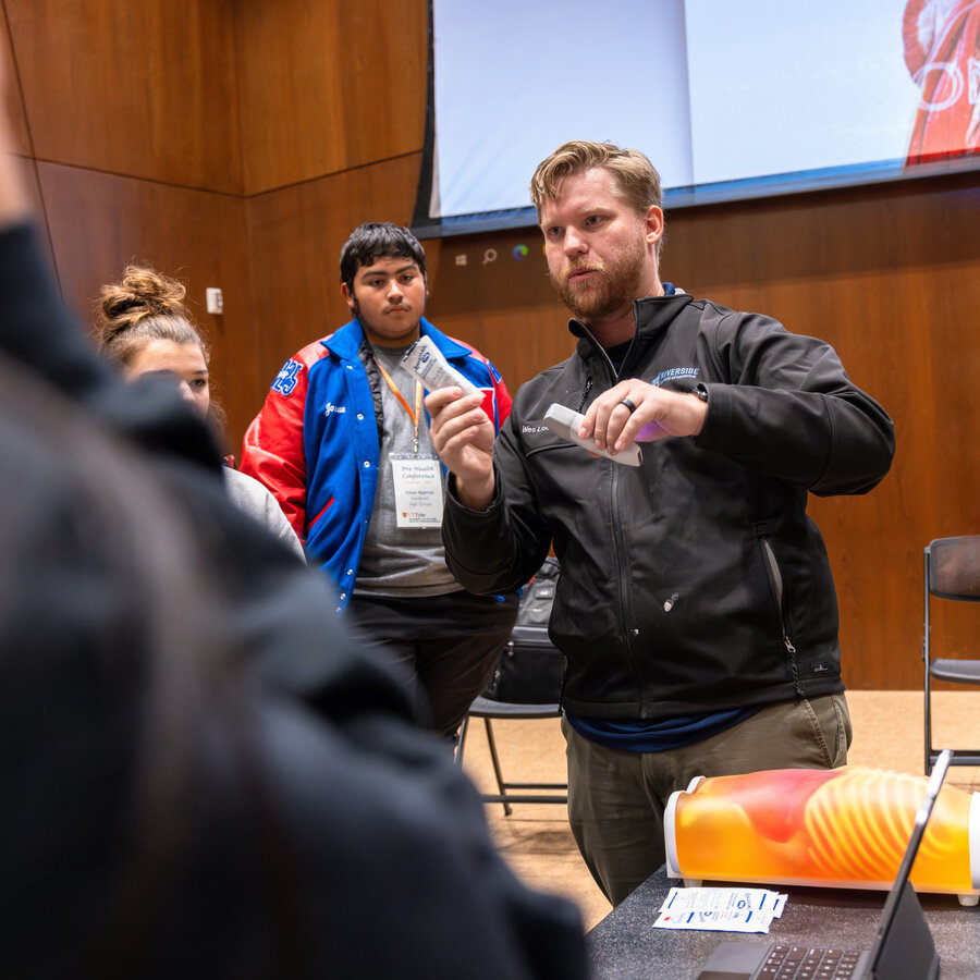 Students watch a demonstration at a pre-health conference