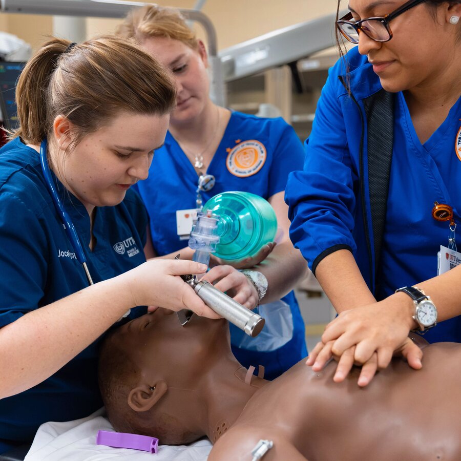 Medical and nursing students working on a patient in the simulation lab