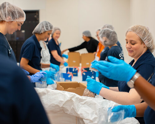 UT Tyler medical students volunteering to pack food boxes.