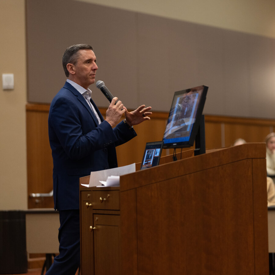 A male presenter at the science in society symposium