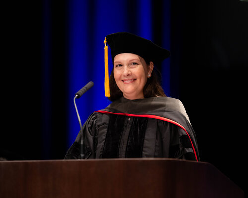 Pharmacy faculty member at the 2023 hooding ceremony