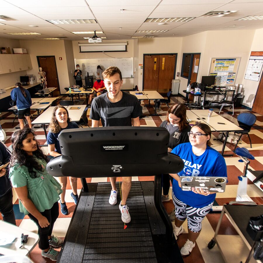 UT Tyler students monitoring another student performing an endurance test on a treadmill