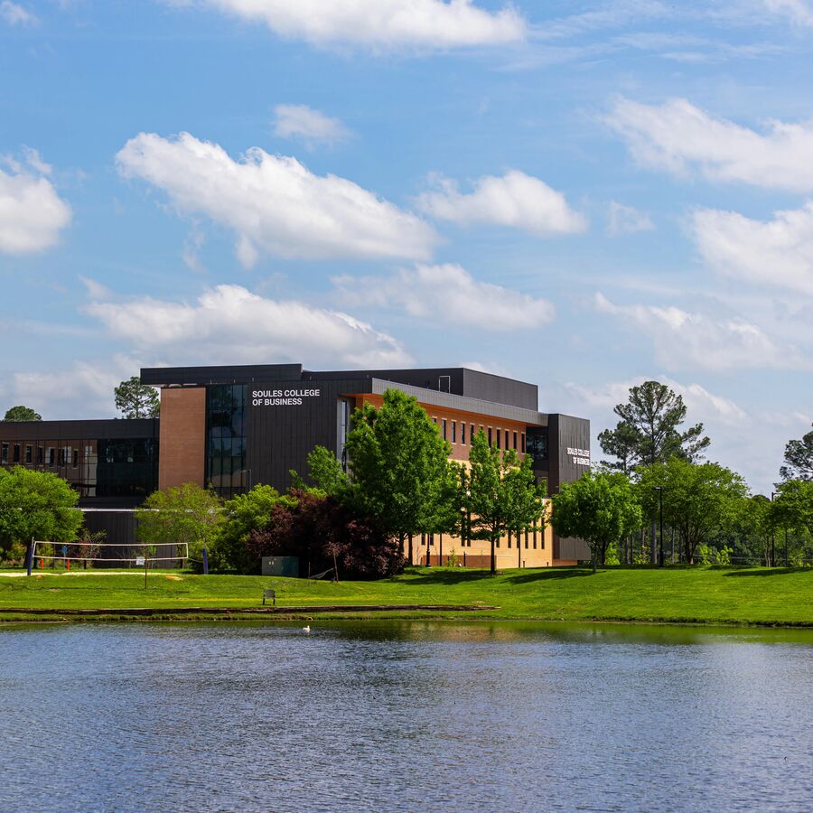 Exterior of Soules College of Busines with a pond in the foreground