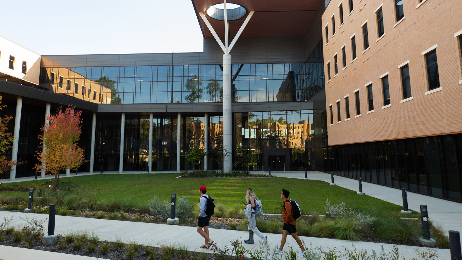 Three students walk outside the Soules College of Business, home of UT Tyler's BBA in Marketing program