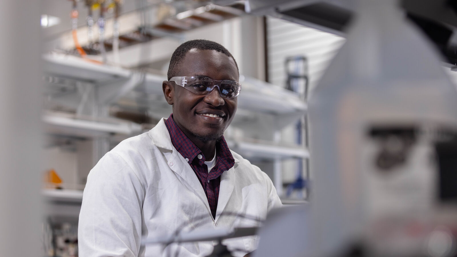A UT Tyler BS in chemical engineering student studies samples in a laboratory environment