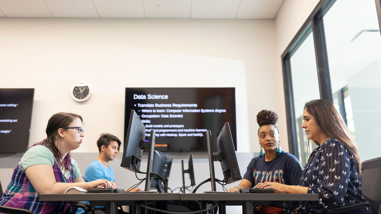 A group of computer science students working in a computer lab at The University of Texas at Tyler
