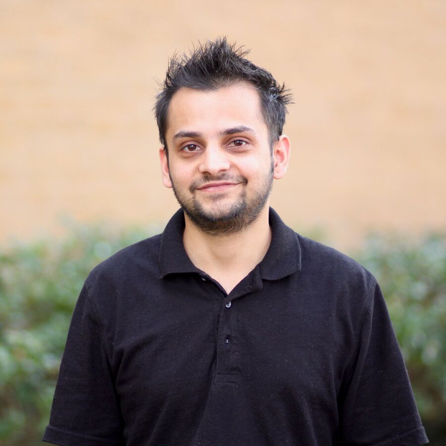 A male industrial technology student stands outdoors at UT Tyler