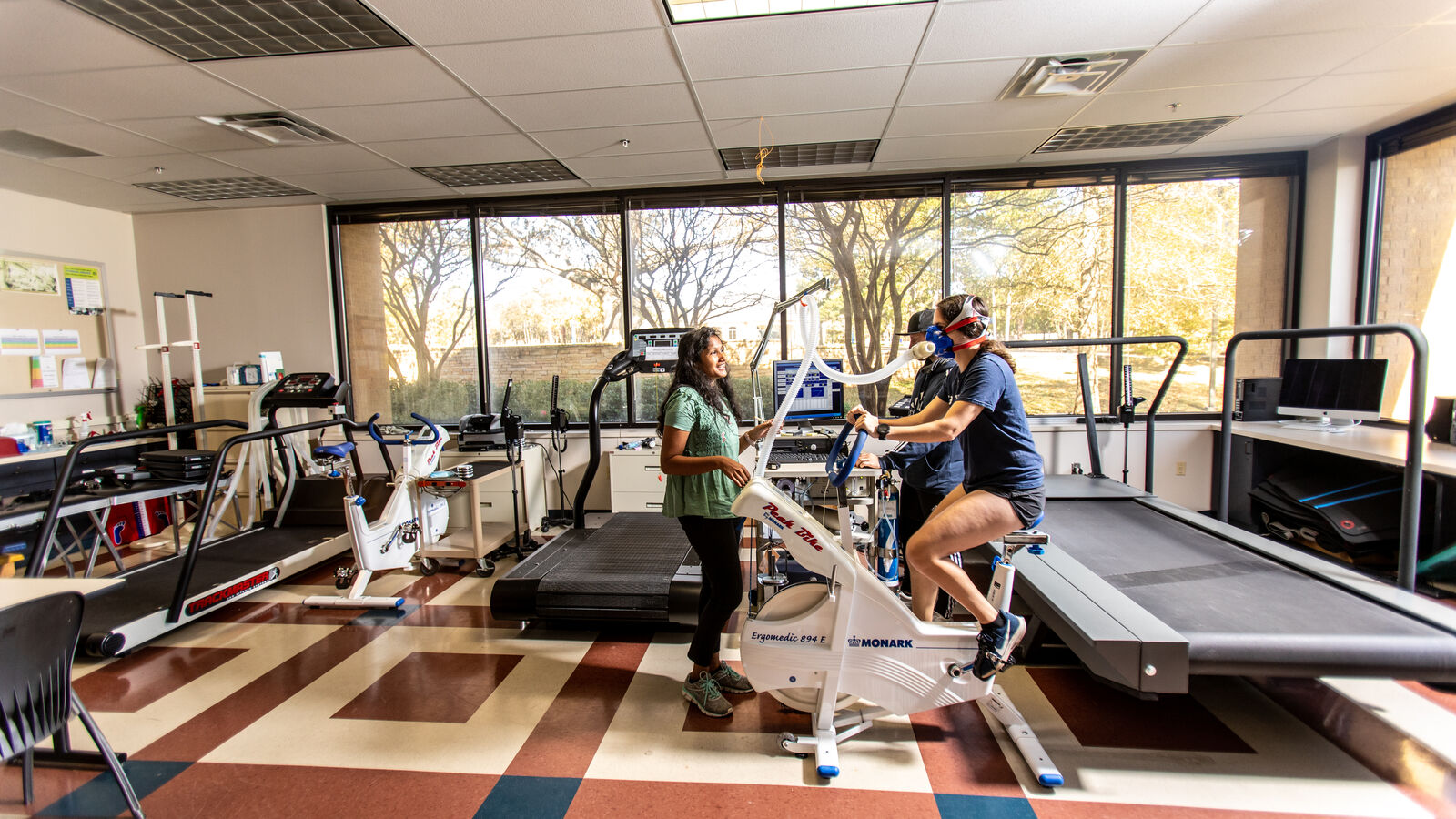 Students test out exercise science equipment in the Kinesiology Respiration Bike Lab at UT Tyler's Herrington Patriot Center.
