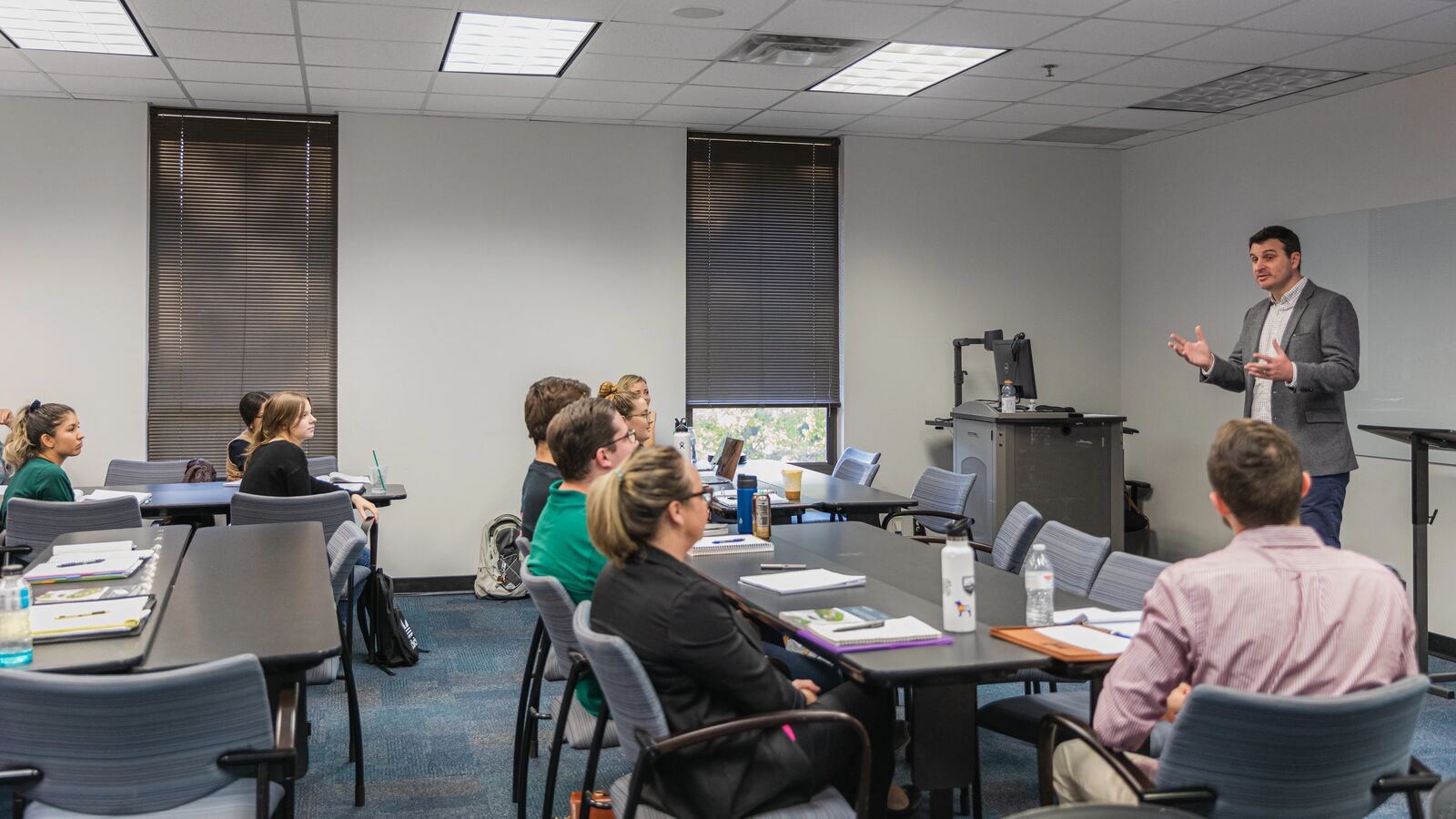 A faculty member speaks to a class of students in UT Tyler's EdD in School Improvement program