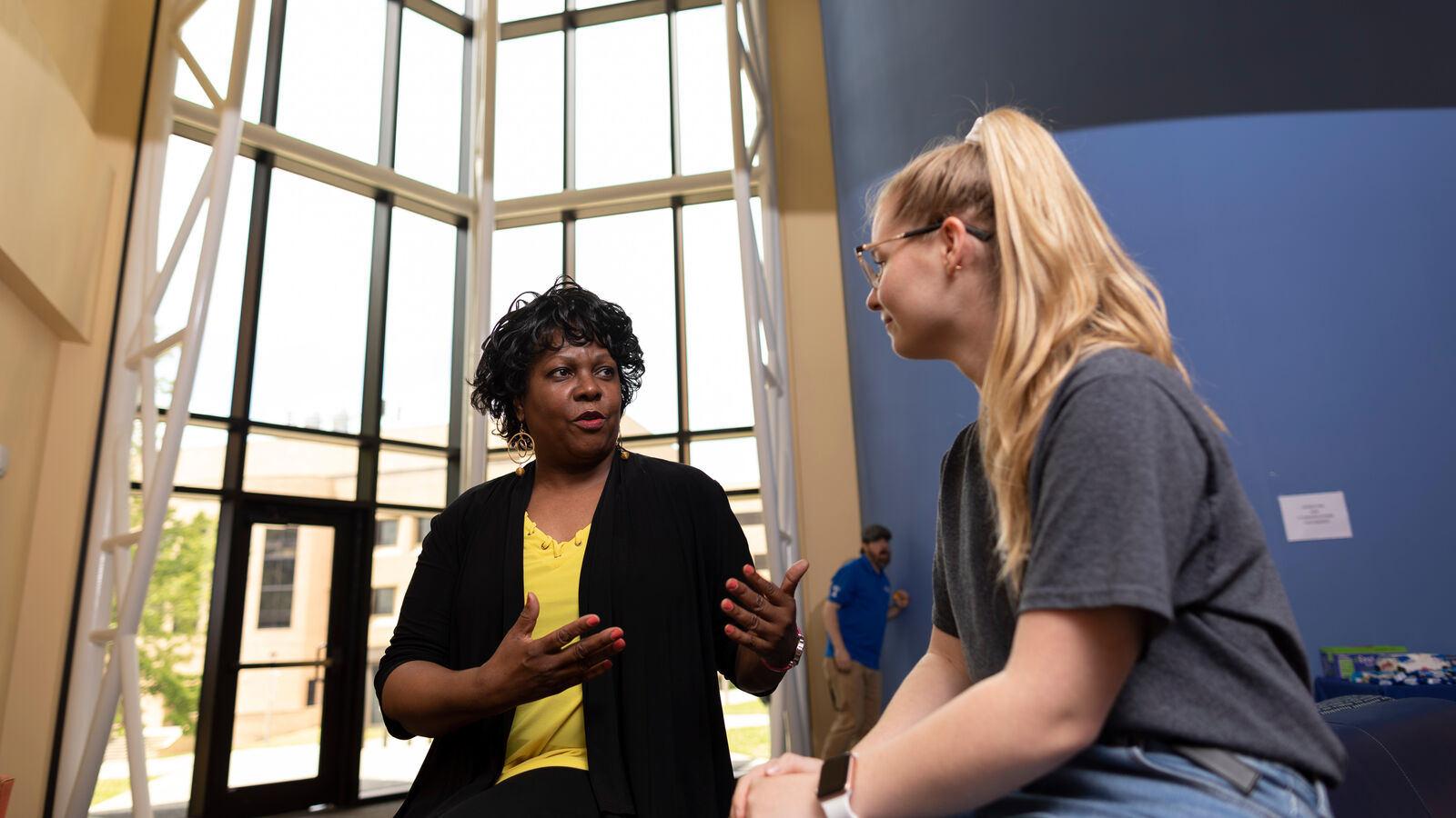 A female instructor has a conversation with a female Clinical Psychology student at UT Tyler's College of Education and Psychology