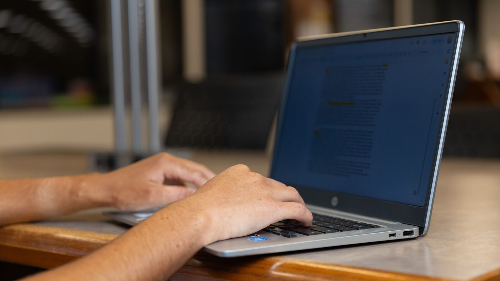 A student studies on a laptop at the Robert R. Muntz Library at The University of Texas at Tyler.