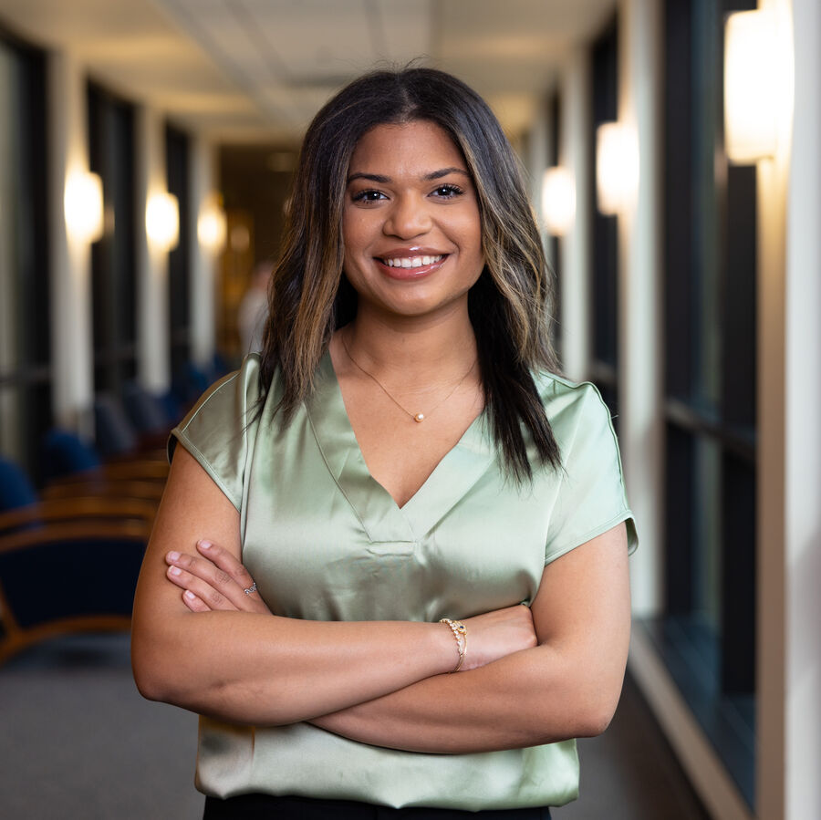 A female pre-med student standing in UT Tyler's School of Nursing