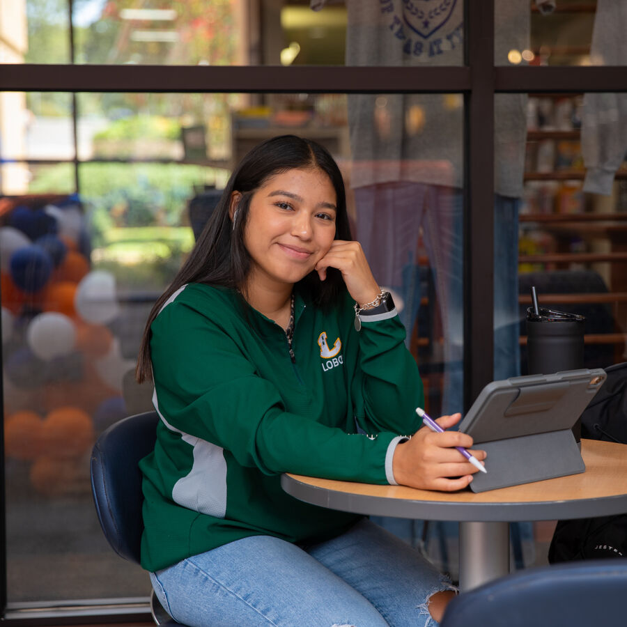 A female student studying with a tablet at The University of Texas at Tyler