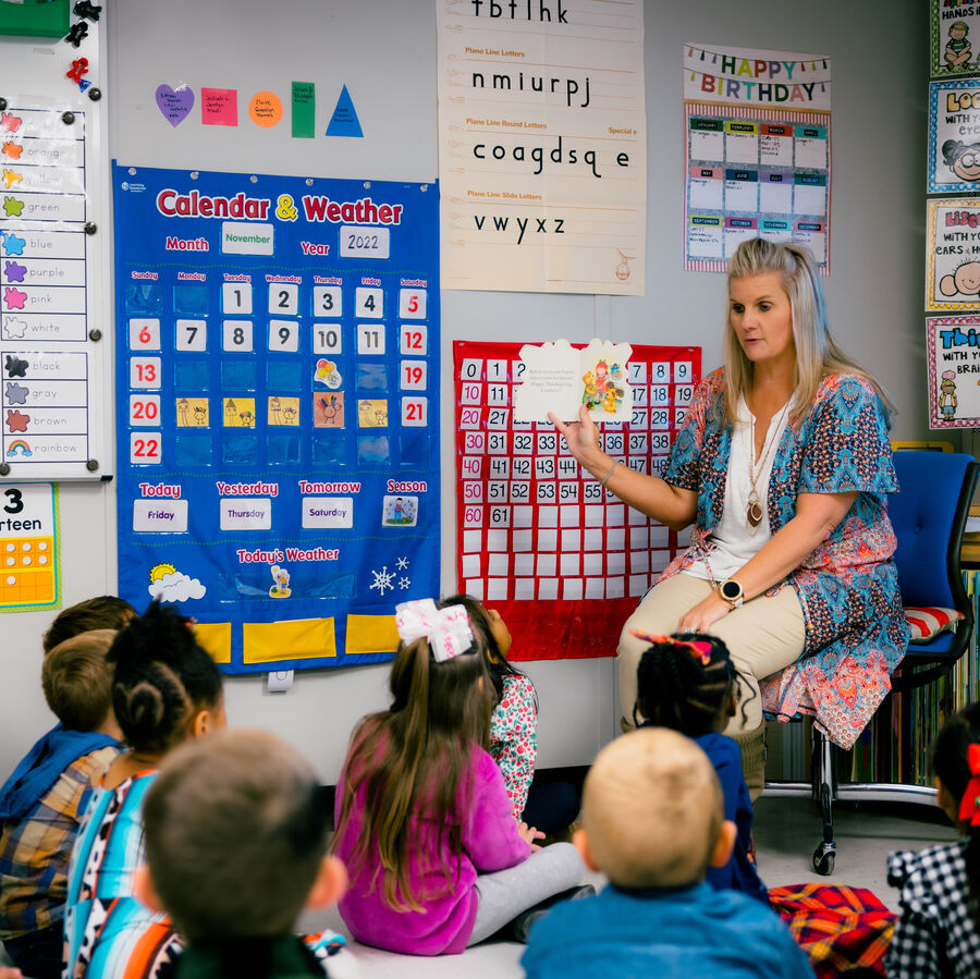 A teacher instructs a group of students at The University of Texas at Tyler's University Academy at the Palestine campus