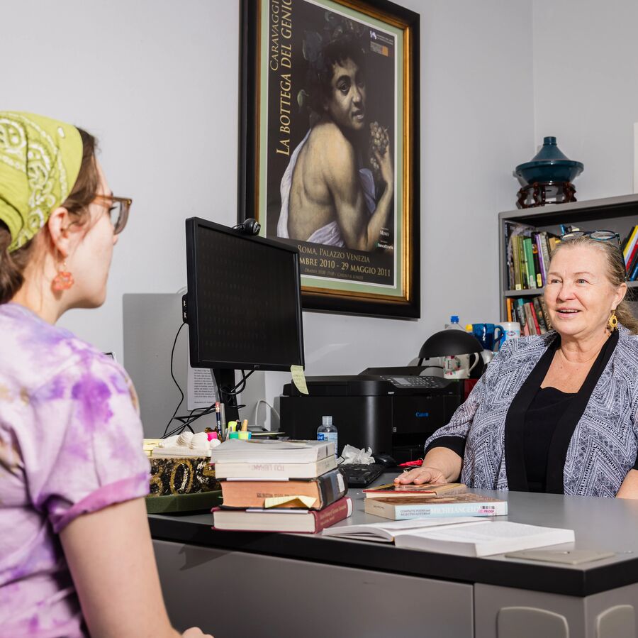 A female student meets with a female faculty member at UT Tyler's Art Department