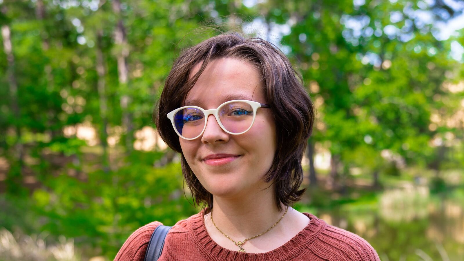 A female student outdoors in spring on The University of Texas at Tyler campus