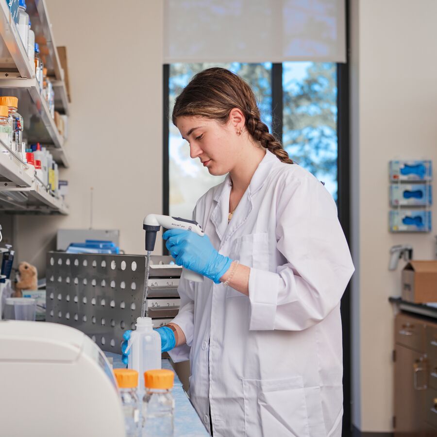 UT Tyler medical student preparing samples in a lab
