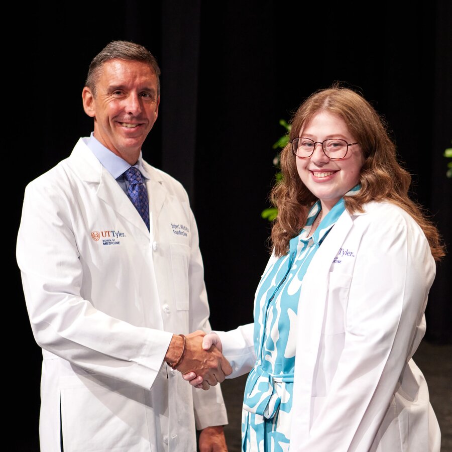 UT Tyler School of Medicine student shaking hands with the Dean