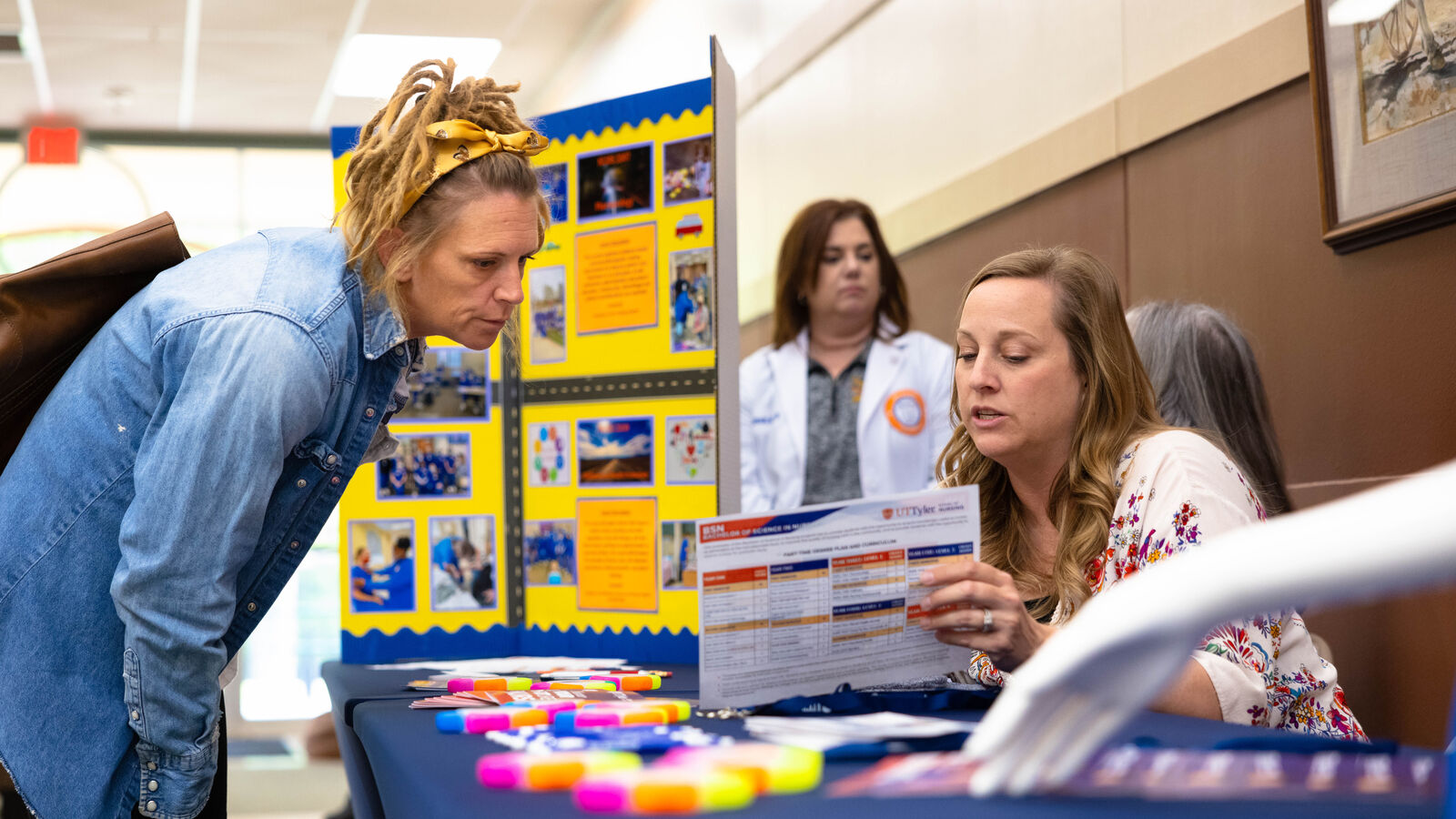 An adult student learns more about available problems at a transfer open house at UT Tyler's Longview University Center