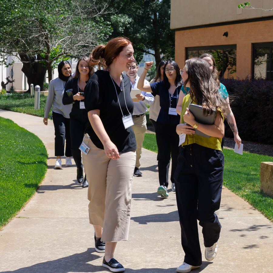 Male and female School of Medicine students talk in a campus lounge at UT Tyler