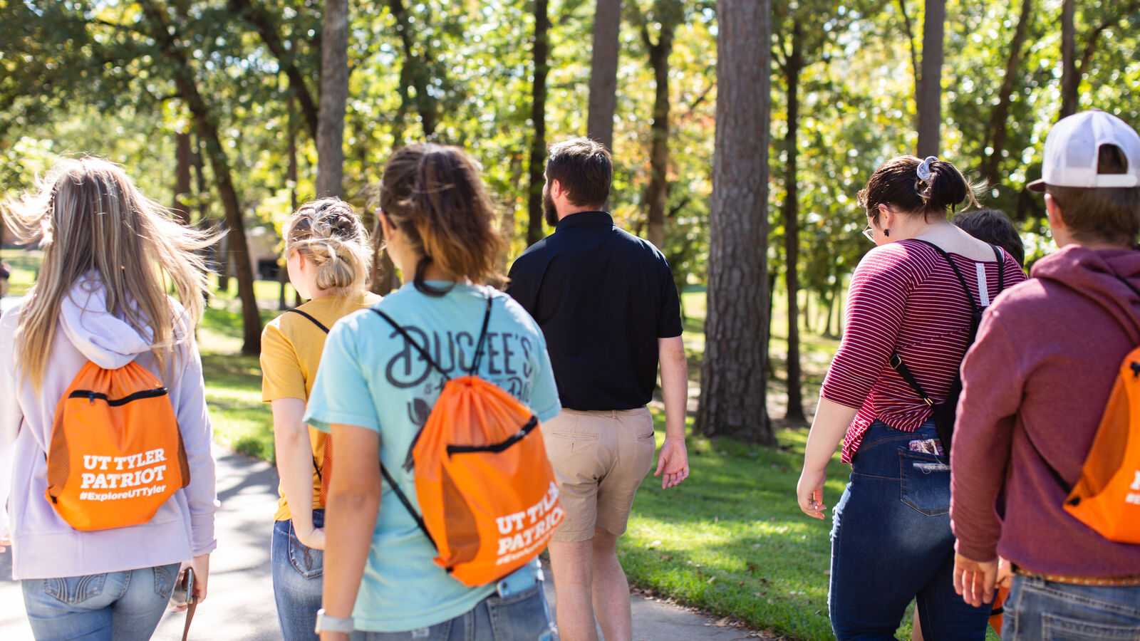 A group of students tour The University of Texas at Tyler's main campus