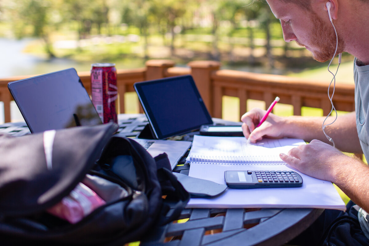 Student studying by harvey lake