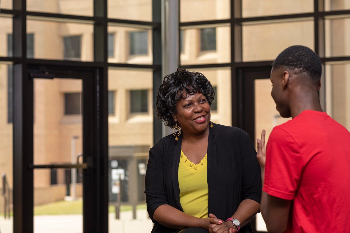 Professor Joyner talking with a student