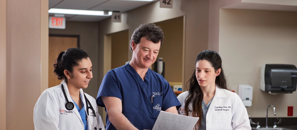 Two medicine students and a professor