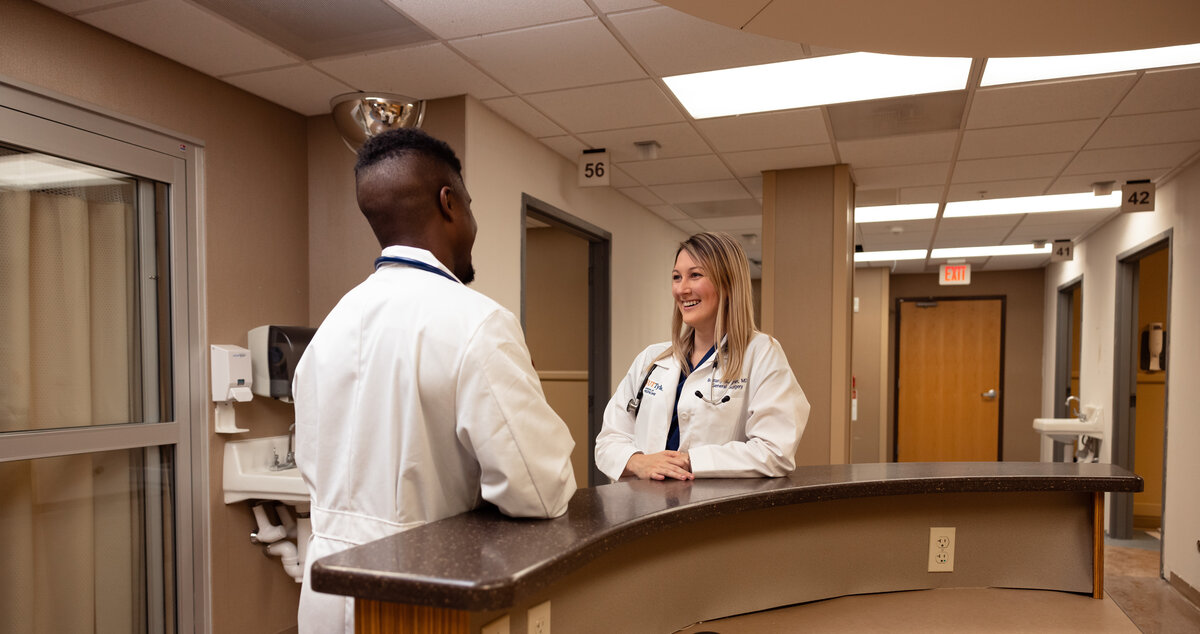 Two medicine students talking in a hospital