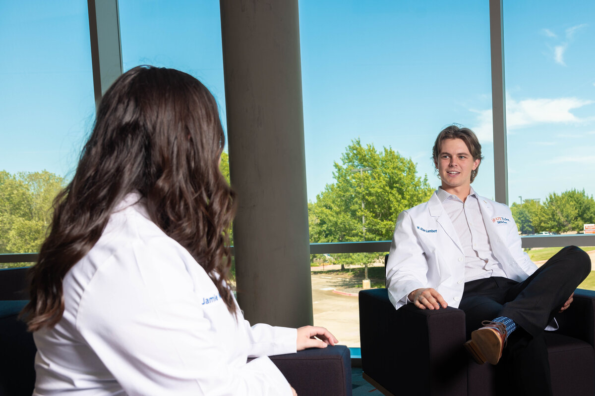 Two medicine students talking to each other