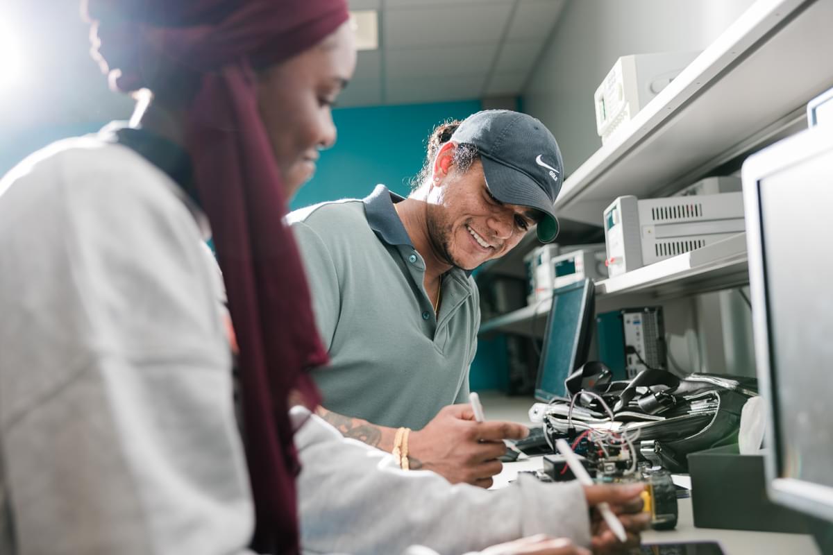 A male and a female UT Tyler students working on a project at the Engineering Center