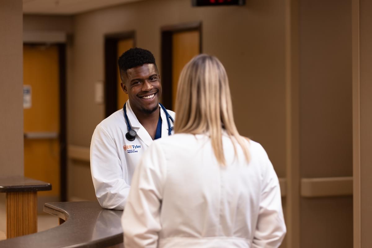 UT Tyler health science residents in the hall at the health center