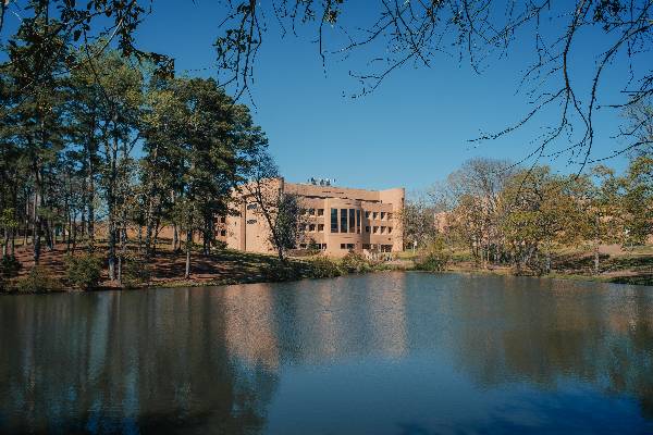 Photo of the Ratliff Engineering Complex from across Harvey Lake