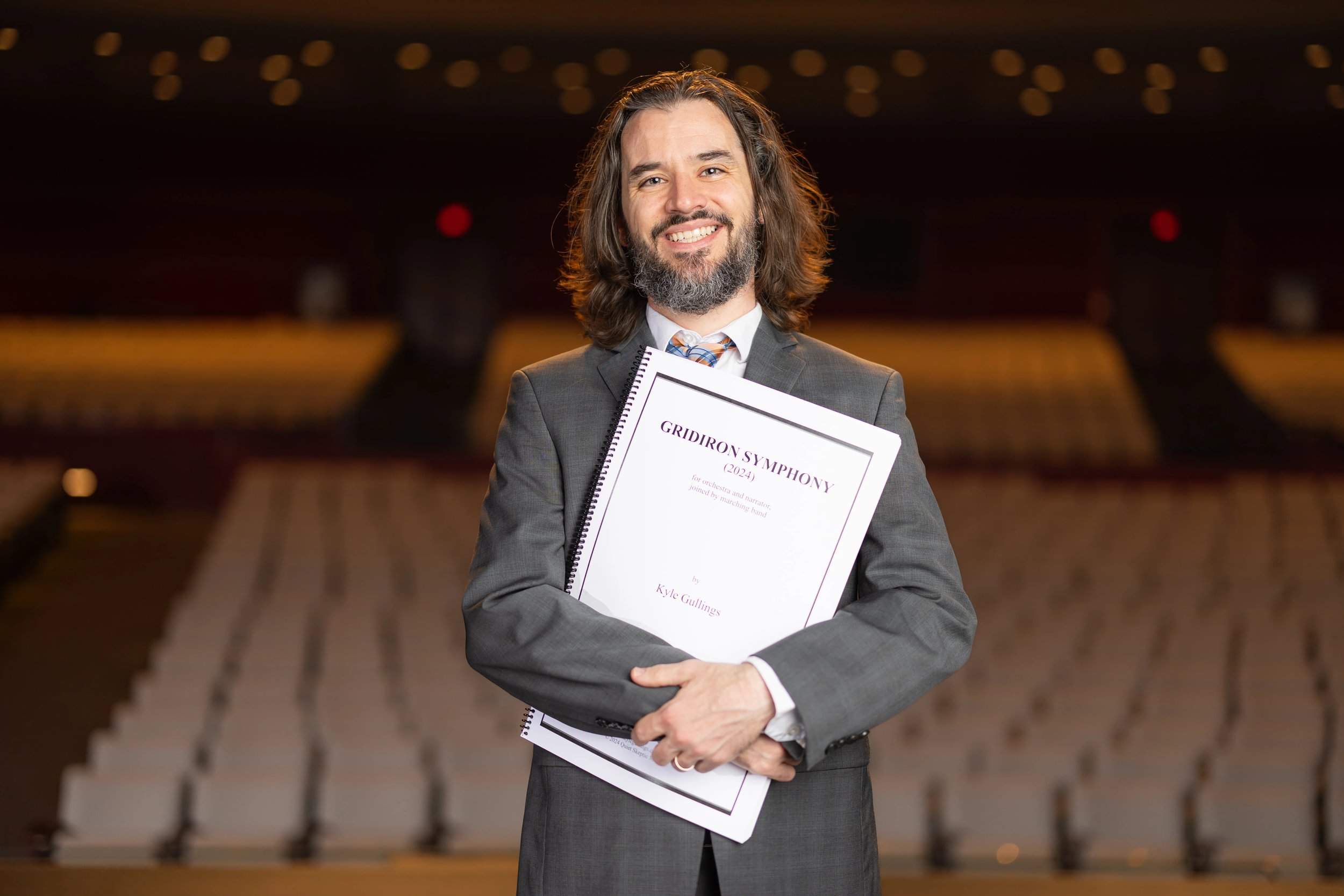 Gullings with copy of his work, Gridiron Symphony