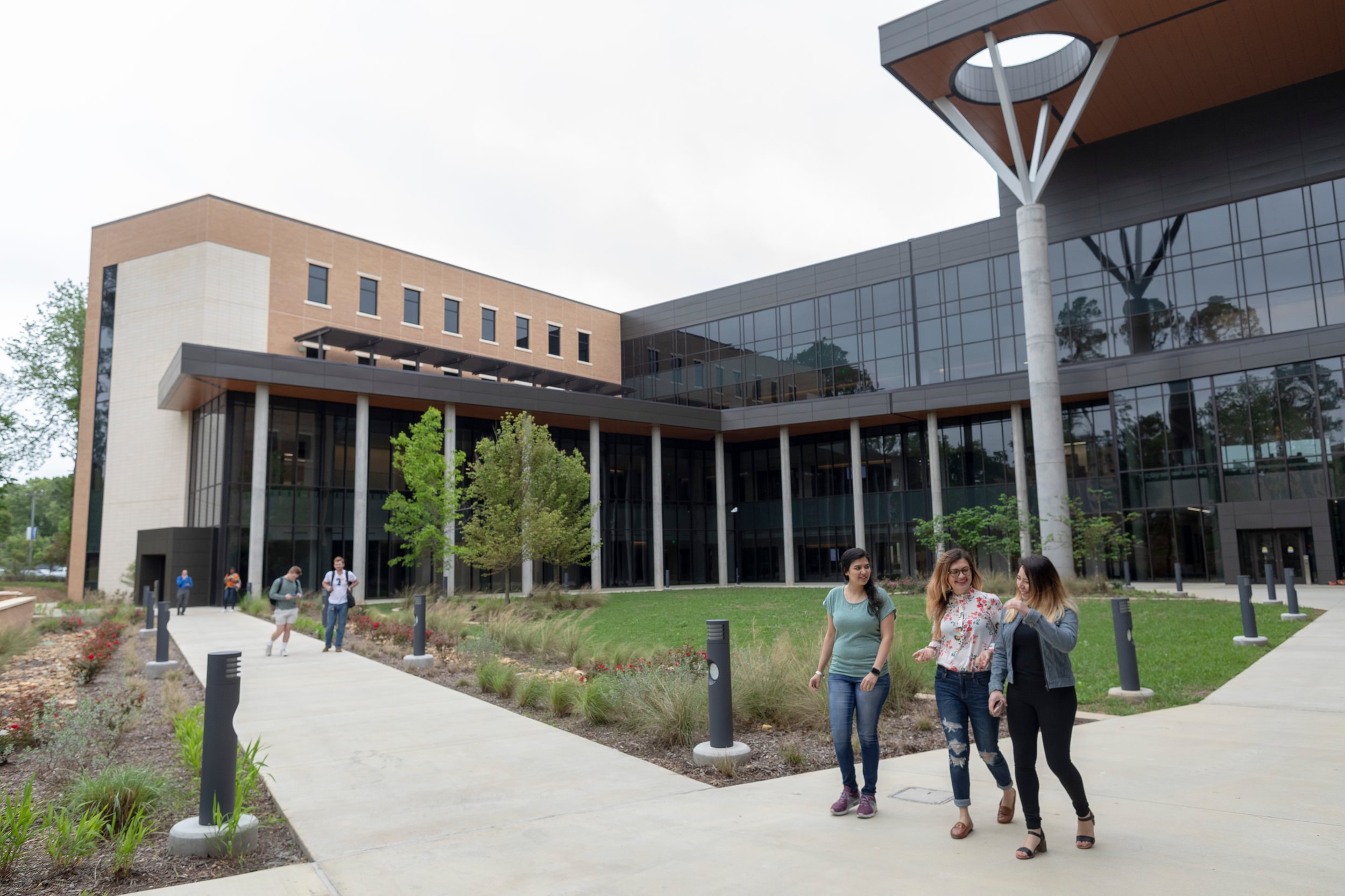 Students walking by Soules College of Business Courtyard