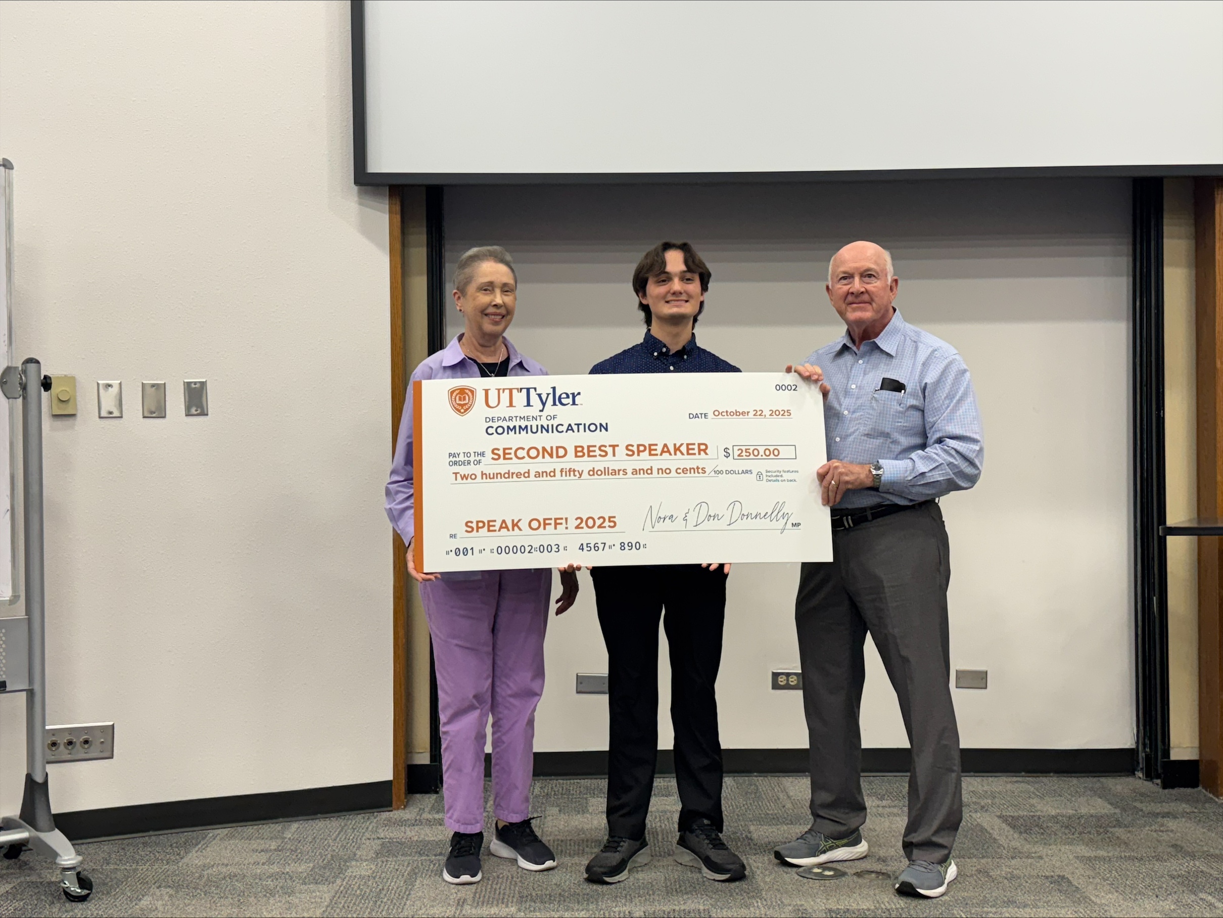 Second-place winner Ayden Haun of Forney with Nora and Don Donnelly of Tyler