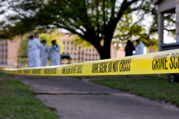 Photo of yellow crime scene tape at mock crime scene event at HSC