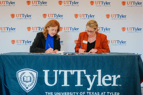 Brownsboro ISD's Dr. Keri Hampton and UT Tyler President Julie V. Philley, MD, signing the MOU agreement during a ceremony at the UT Tyler campus