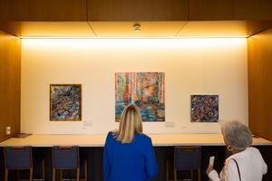 Faculty, staff, students and guests view the 32 original works by local artists, displayed throughout W.T. Brookshire Hall, home of the UT Tyler Fisch College of Pharmacy. 