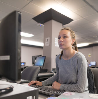 student working at a computer