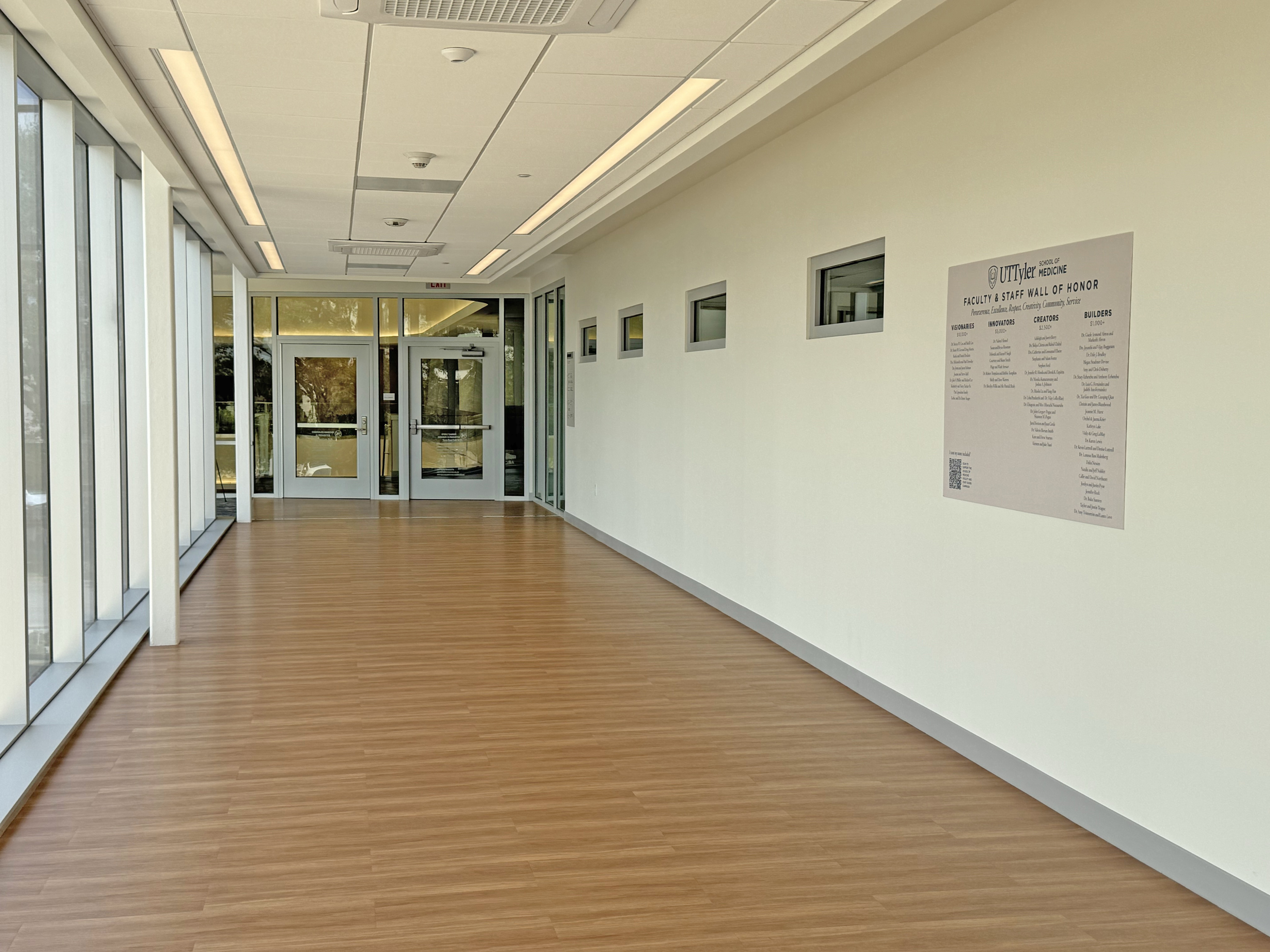 School of Medicine skybridge hallway and temporary donor wall sign.